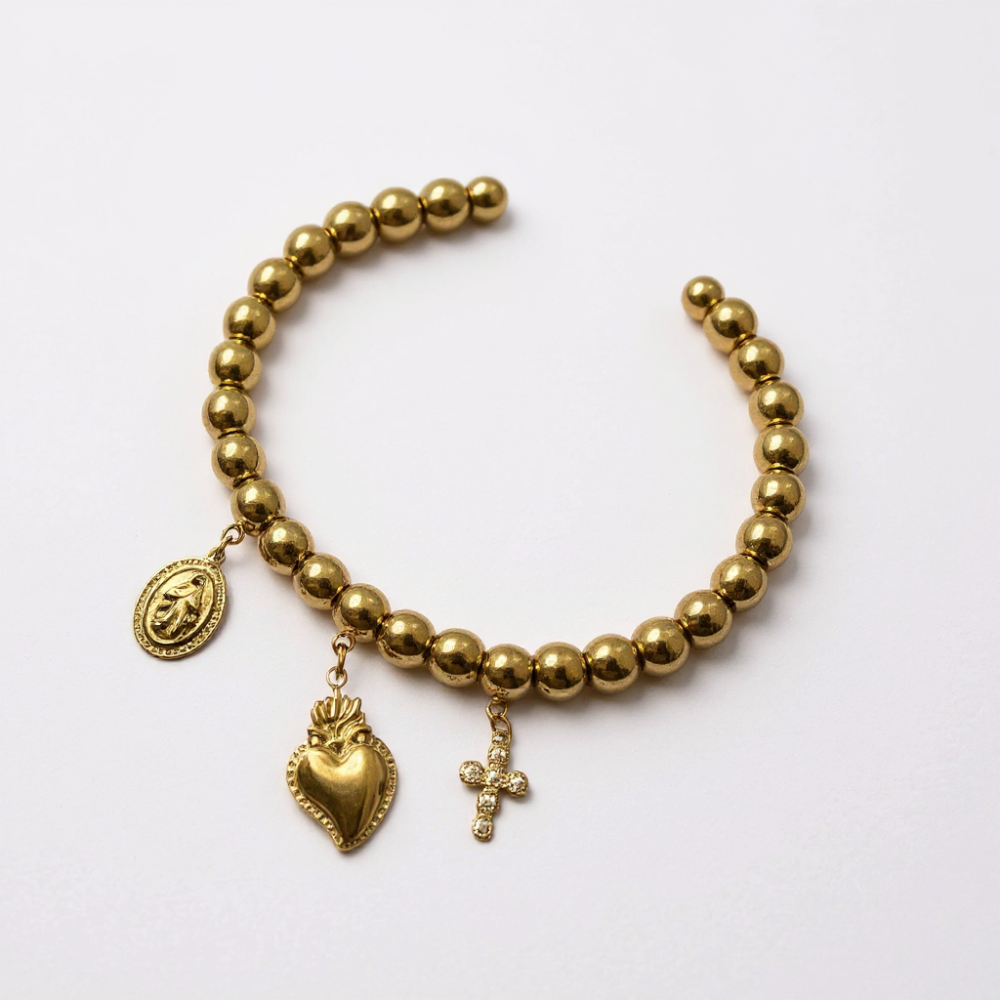 Bracelet perles dorées avec médaille religieuse, cœur sacré et croix