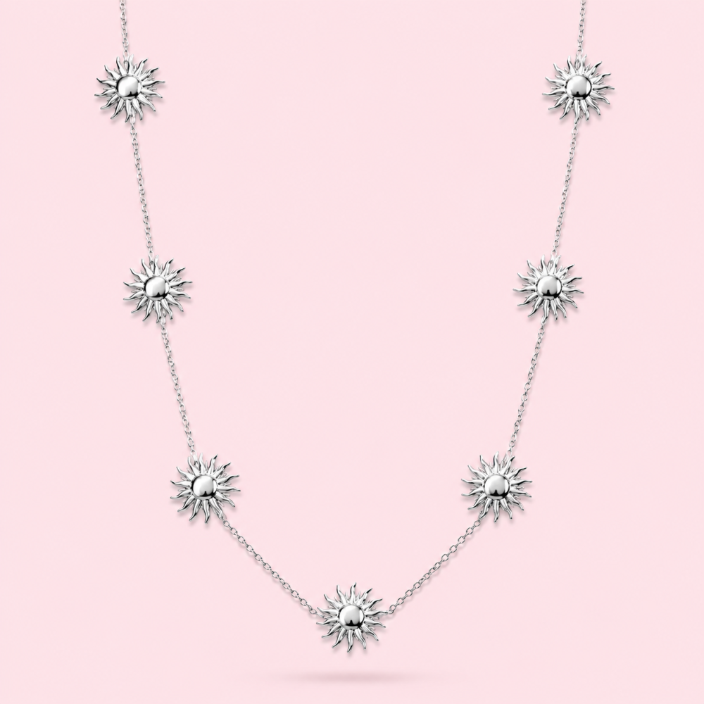 Sautoir argenté en acier inoxydable avec pendentifs soleil